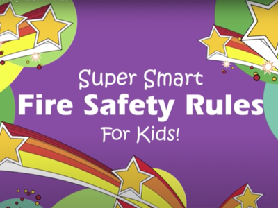 A colorful illustration displaying the text "Super Smart Fire Safety Rules for Kids!" set against a purple background with stars, rainbows, and decorative elements. The design is lively and eye-catching catering to a young audience.