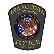 Franconia Township Police patch with a bald eagle over a U.S. flag background, reading "Montgomery County Pennsylvania" and "Police Est. 1962.